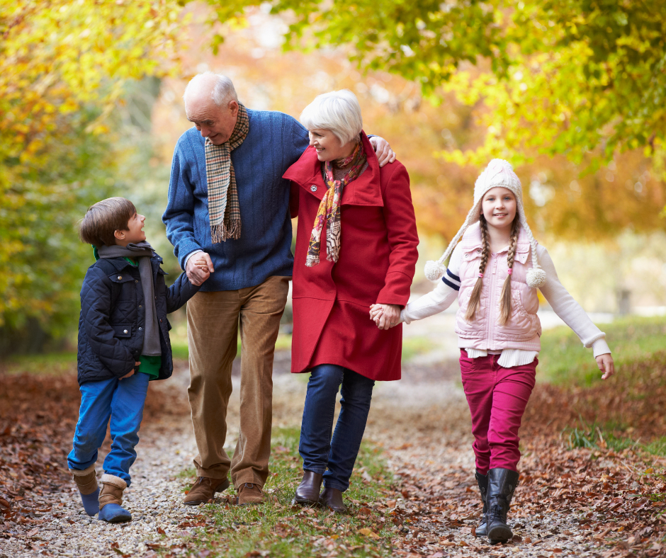 Grandparents walking with grandchildren in the fall need estate planning.