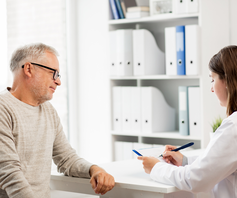 Older Man meeting with a Medical Provider to disucss his Personal Health Information covered by the HIPAA Privacy Act.