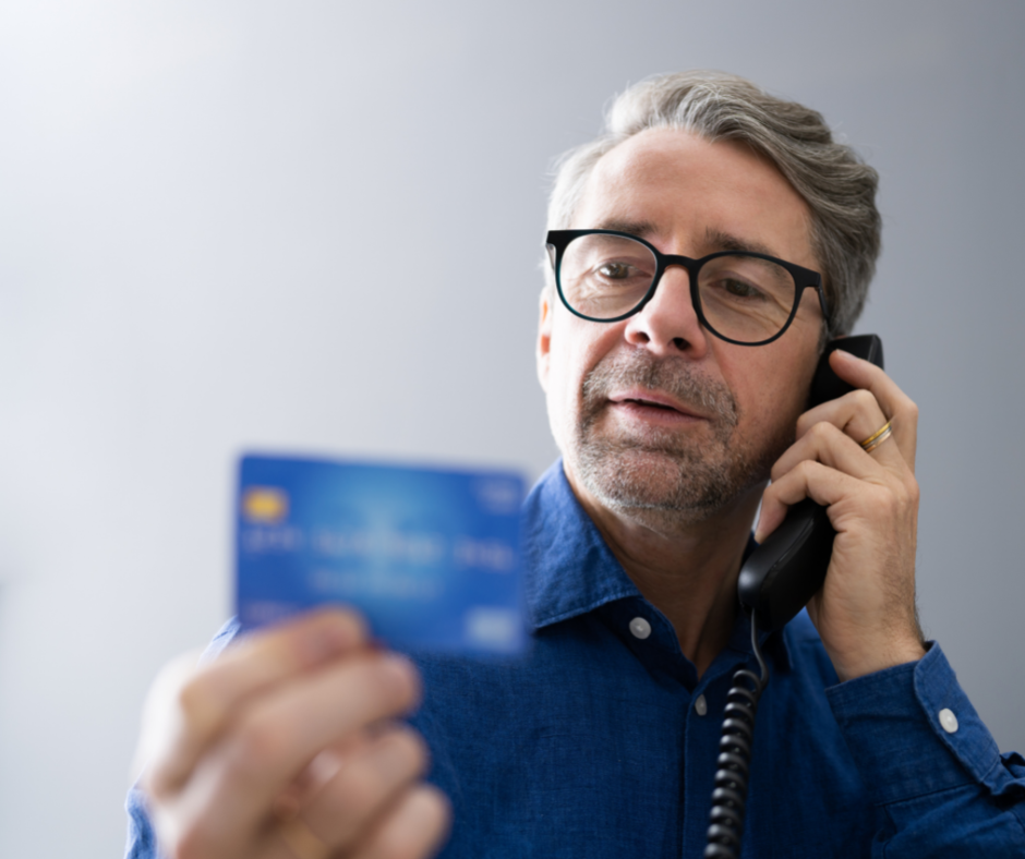 Older man giving his credit card number over the phone