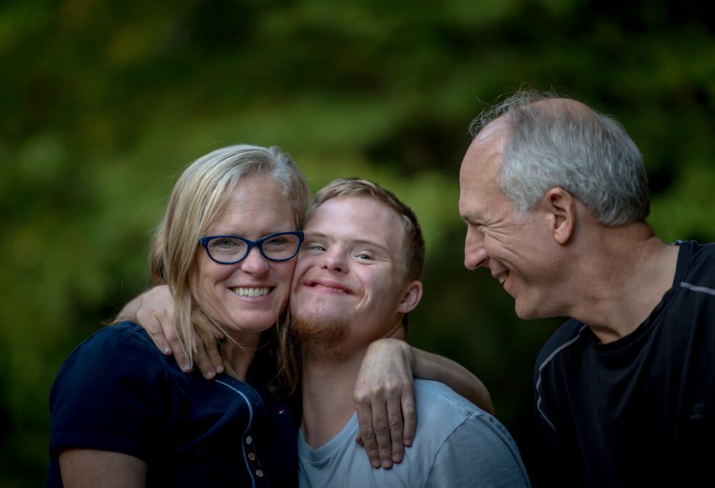 Young man with Special Needs with his parents - needs Elder Law Planning.